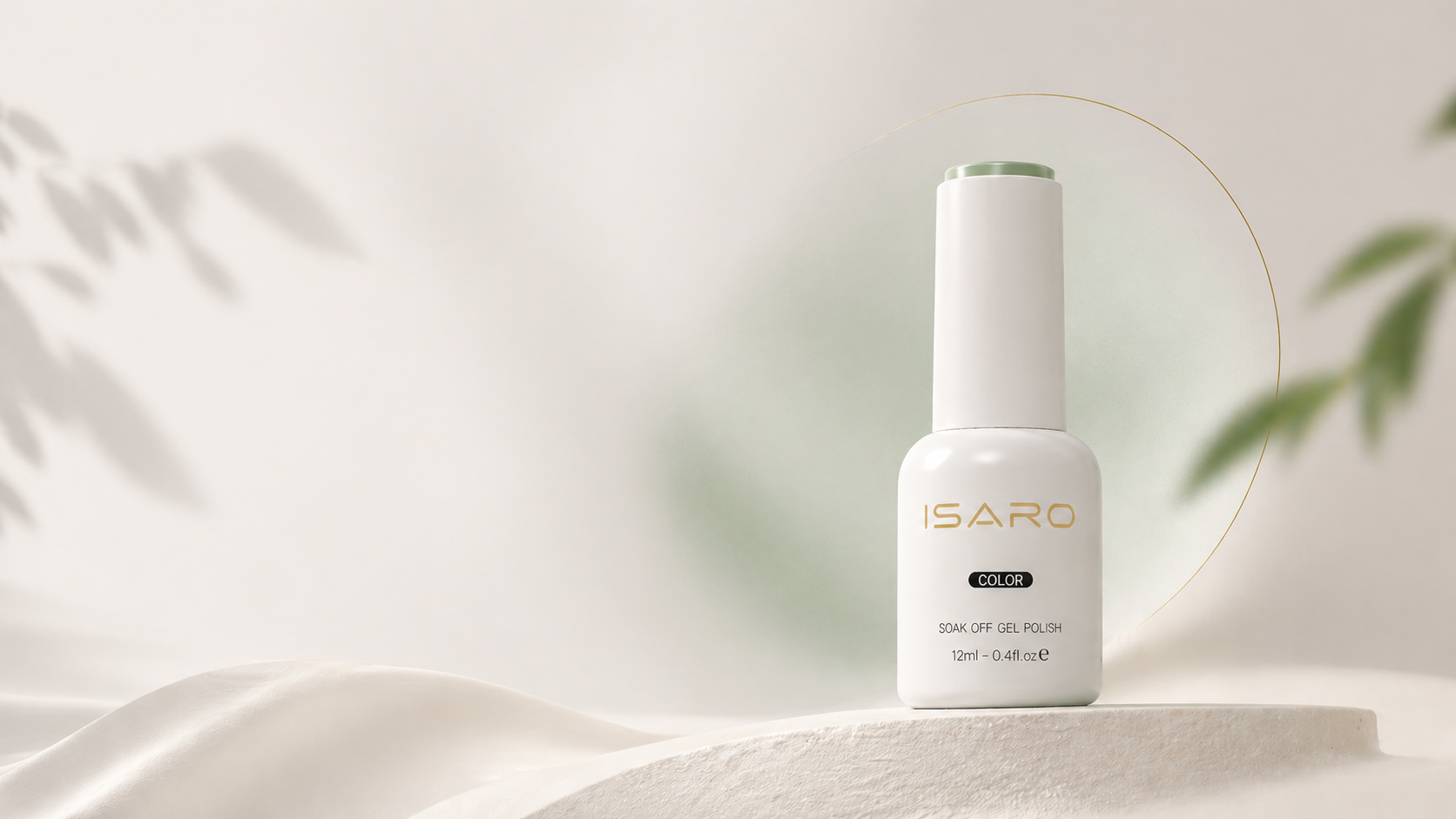 ISARO gel polish bottle on a soft neutral fabric set
